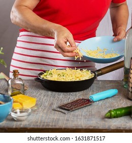 Woman Cooking Pasta With White Cream Sauce At Home In The Kitchen