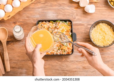 Woman Cooking Rice Casserole On Table, Top View