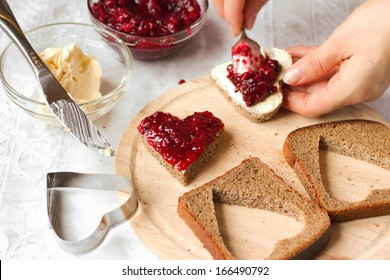 Woman Cooking A Sweet Breakfast - Bread With Jam