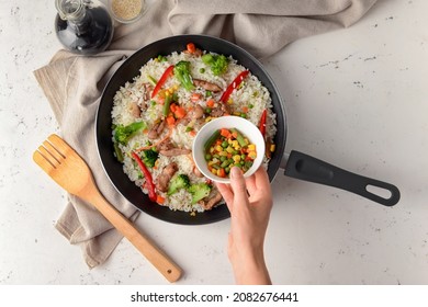 Woman Cooking Tasty Fried Rice, Top View