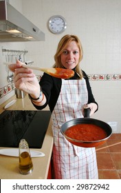 Woman Cooking Tomato Sauce For Pasta