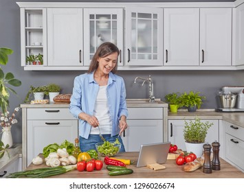 Woman Cooking While Watching Digital Tablet Stock Photo 1296026674 