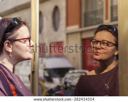 Similar – Image, Stock Photo Twin sisters take pictures of each other with smartphone at a bridge railing