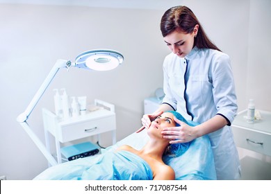 A woman cosmetologist at work in the hospital