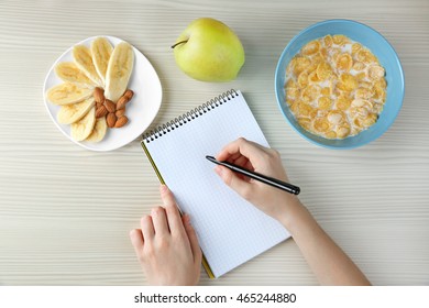 Woman Counting Calories, Top View