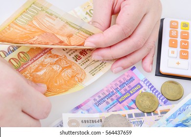 Woman Counting Hong Kong Dollar Banknotes