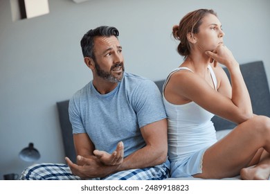 Woman, couple and conflict on bed with argument for disagreement, fight and cheating affair. Stress, people or ignore for toxic relationship, marriage fail and breakup with dispute in bedroom of home - Powered by Shutterstock