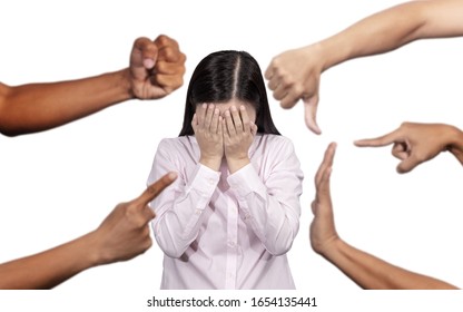 Woman Covered Her Face With Regret For Being Bullying , Sexism , Racism And Hate Surrounded By Hands Mocking Her, Scoffing With Offended At Social Of Workplace 