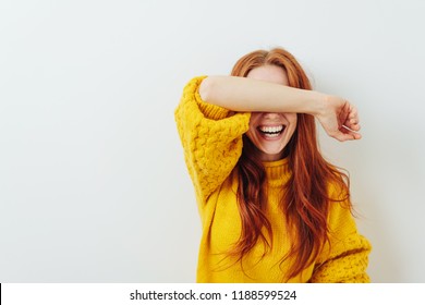 Woman Covering Her Eyes With Her Arm While Waiting For A Surprise