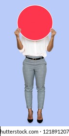 Woman Covering Her Face By A Blank Board