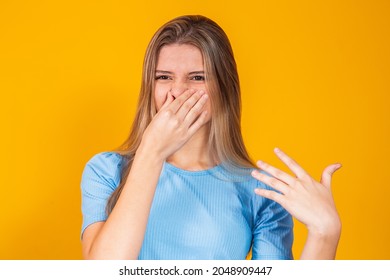 Woman Covering Her Nose For Bad Smell, Concept Of Stink Thing, Bad Breath, Unpleasant Smell, Rotten Food, Odor, Body Bad Smell; Young Adult 