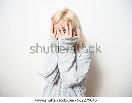 Young blonde woman with a headache