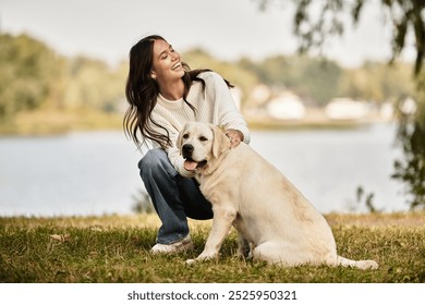 A woman in cozy autumn attire smiles warmly as she plays with her dog in a park setting. - Powered by Shutterstock