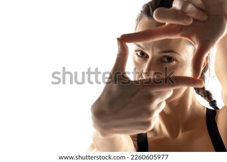 Similar – Image, Stock Photo Close up side view profile portrait of one young middle age athletic woman shadow boxing in sportswear in gym over dark background, looking away