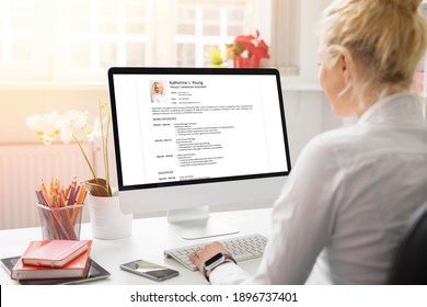 Woman creating her CV on computer. All contents in document are made up.