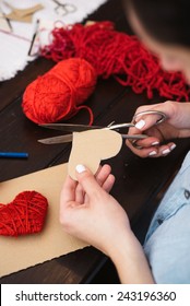 Woman Creating Red Woolen Heart 