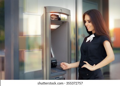 Woman With Credit Card At ATM Cash Machine - Elegant Business Woman Checking Account Balance 
