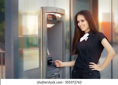 Woman With Credit Card At ATM Cash Machine - Elegant Business Woman Checking Account Balance 
