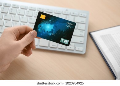 Woman With Credit Card At Table