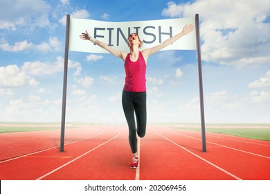 Woman Crossing The Finish Line