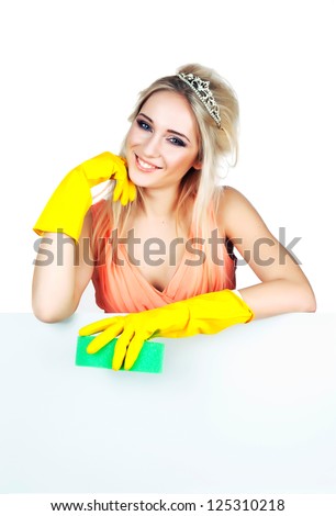 woman with a crown in evening dress and rubber gloves for cleaning
