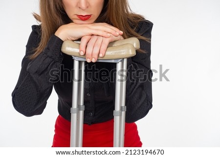 woman with crutches. Lady and two crutches. Girl is disabled. Person with disabilities. Woman with disability on white. Disabled rehabilitation concept. Rehabilitation after leg problems.