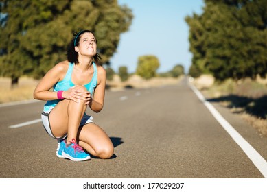 Woman Crying For A Painful Knee Injury During Running Training.