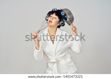 woman with curlers with cutlery in their hands                               