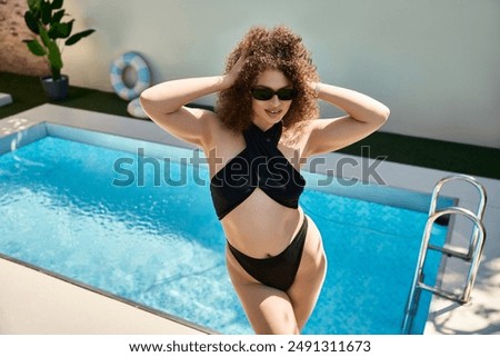 Similar – Brunette surfer woman in bikini standing with surfboard