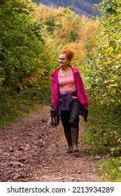 Woman With Curly Hair, Nature Photographer, Hiking In The Mountain Forests