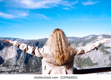 Woman With Curly Hairs Standing Back. Mountains Background In Grand Canyon