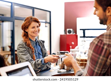 Woman, customer and credit card at a coffee shop for payment with a smile at restaurant. Female person, happiness and machine scan to pay and buy at a cafe with male store assistant and barista - Powered by Shutterstock