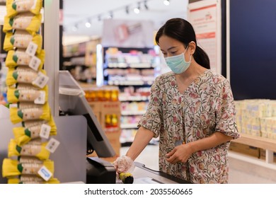 Woman Customer In Protective Mask Self Service Check Out Till And Digital Bar Code Scanner