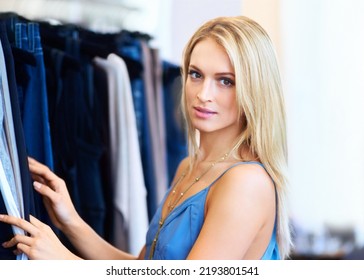 Woman Customer Shopping In Store And Designer Retail Jeans Choices. Buy Fashion Clothes At Creative Boutique, Portrait Of Serious Young Blonde Shopper Making Purchase Decision And Consumer Lifestyle