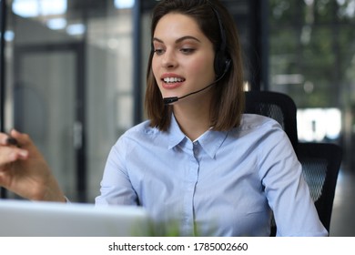 Woman customer support operator with headset and smiling. - Shutterstock ID 1785002660