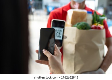 Woman Customer Using Digital Mobile Phone Scan QR Code Paying For Buying Fresh Food Set Bag From Food Delivery Service Man, Express Delivery, Digital Payment Technology And Fast Food Delivery Concept