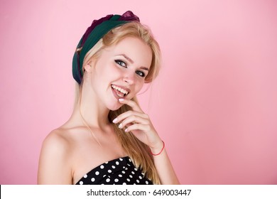 Woman Or Cute Girl, Fashionable Model With Colorful Hairband On Long, Blonde Hair Smiling With Healthy, White Smile, Teeth On Pink Background. Beauty, Fashion, Copy Space