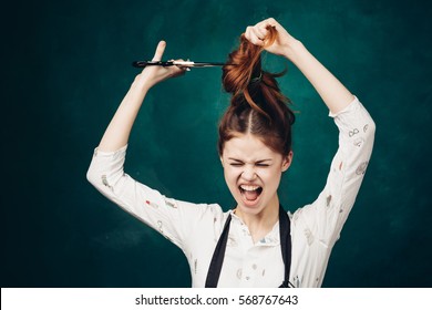 Woman Cuts Off The Hair With A Cry, A Woman With Scissors