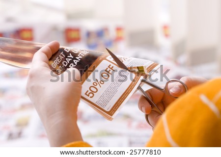 Woman cutting abstract discount coupon