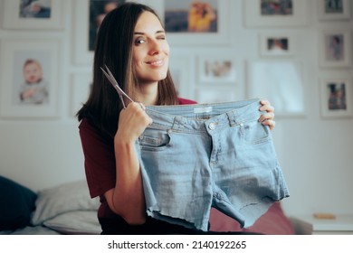 
					Woman Cutting Her Jeans for Summer Making Short Pants. Girl recycling a pair of old worn denim trousers making a new outfit item
					