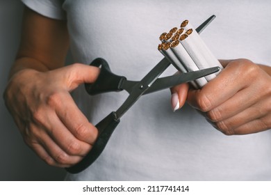 Woman Cutting With Scissors Cigarettes. Stop Smoking, Quit Smoking Or No Smoking Concept. Woman Refusing Tobacco. Quit Bad Habit