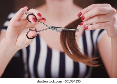 Woman Is Cutting Tress With The Blending Scissors