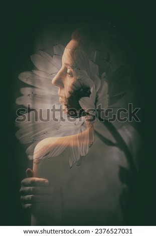 Similar – a girl with a white lily and eyes closed worried