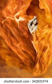 Woman Dance in Fire, Fashion Girl Orange Dress Dancing Fabric Flowing as Silk Flame