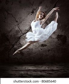 Woman dancer jump posing on background - Shutterstock ID 80685640