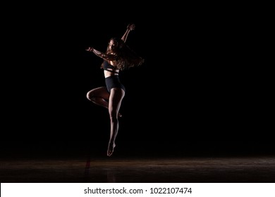 Woman Dancer On Black Jumping