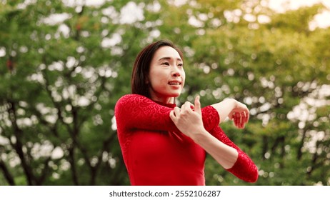 Woman, dancer and stretching arms in park for warm up, fitness or ready for performance in nature. Person, ballet and rehearsal for concert, contest or recital with art, talent and prepare in Japan - Powered by Shutterstock