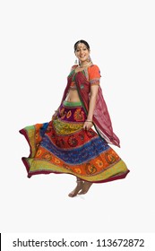 Woman Dancing In Colorful Lehenga Choli