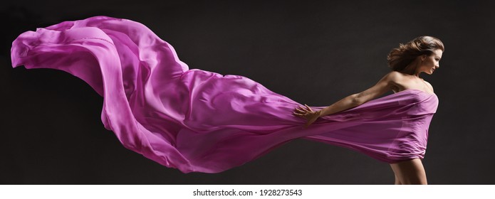 Woman Dancing. Modern Ballet Dancer With Long Fabric Banner Flying On Wind In Air. Copy Space. Black Background