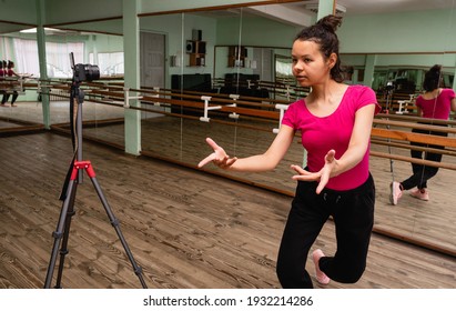 Woman Dancing Modern Dance. Young Woman Recording On Camera A Dance Lesson In A Choreography Hall With Mirrors. 